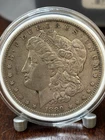 1889 O Morgan Silver Dollar 90% Silver Au. In Capsule
