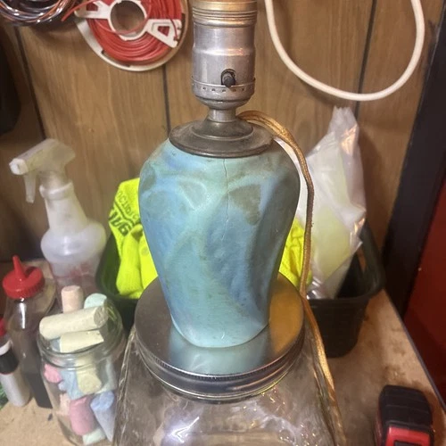 Van Briggle Pottery vase featuring iconic "Double-A" logo and turquoise glaze.