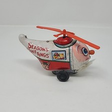Vintage Tin Wind-Up Yuletide Santa Claus Copter Reindeer Toy