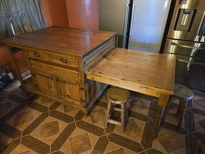 kitchen island with drop leaf table, second pull out table, and barstools