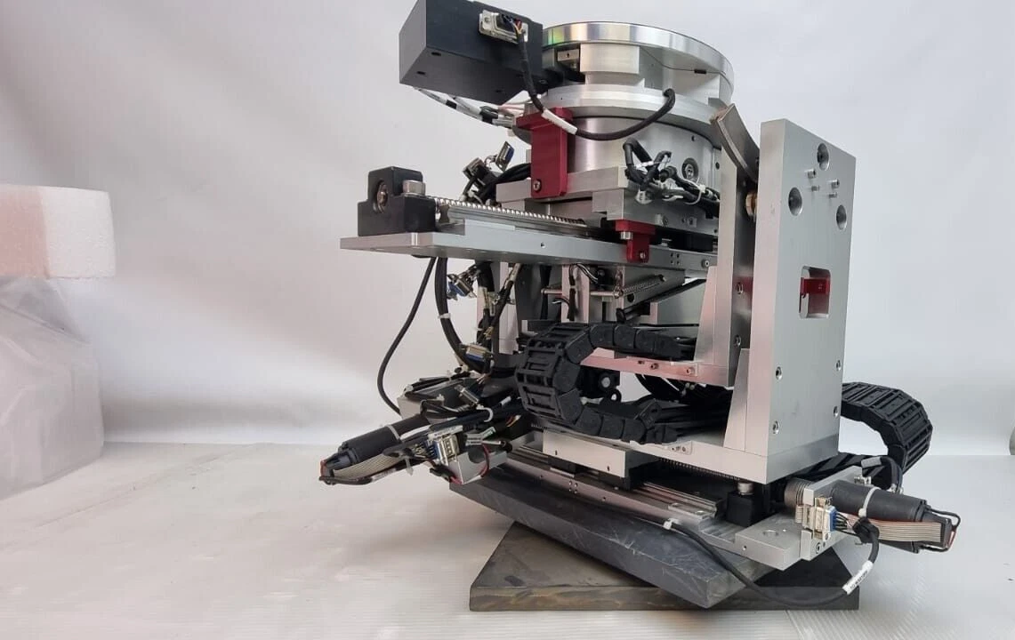Side view of the XYZ tilt stage showing ball screw, red brackets and drag chains