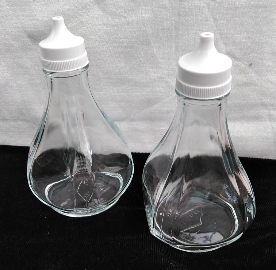 Oil & vinegar clear glass dispensers x 2, Barnett UK, white tops, 1980s vintage
Opens in a new windo