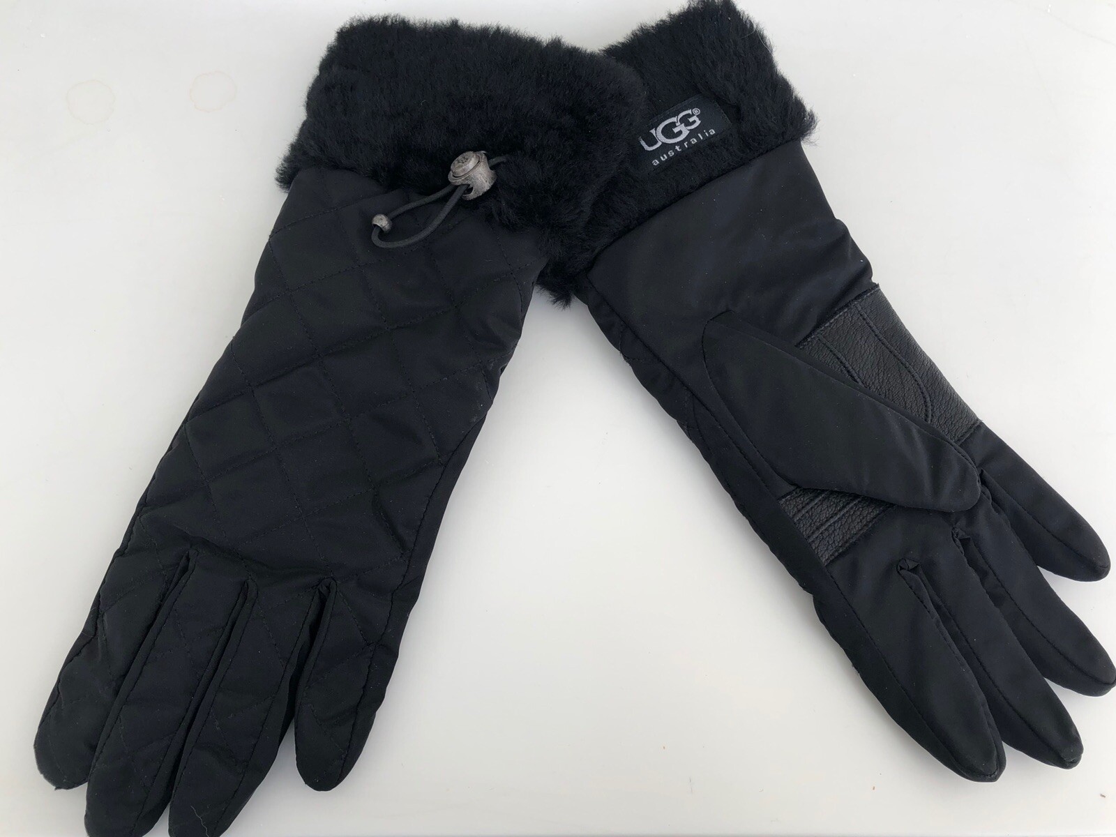 Ugg black nylon and leather gloves. Fur cuffs with toggles