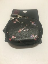 Ear buds carrying case with a zipper and clip