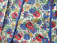 A Vintage NOS Cotton Full Bib Apron Bright Floral Print Scallops Bound Seams
