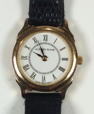 ALFRED SUNG WOMENS WATCH; SWISS; GOLD CASE; WHITE FACE; A.S. LEATHER BAND WORKS!