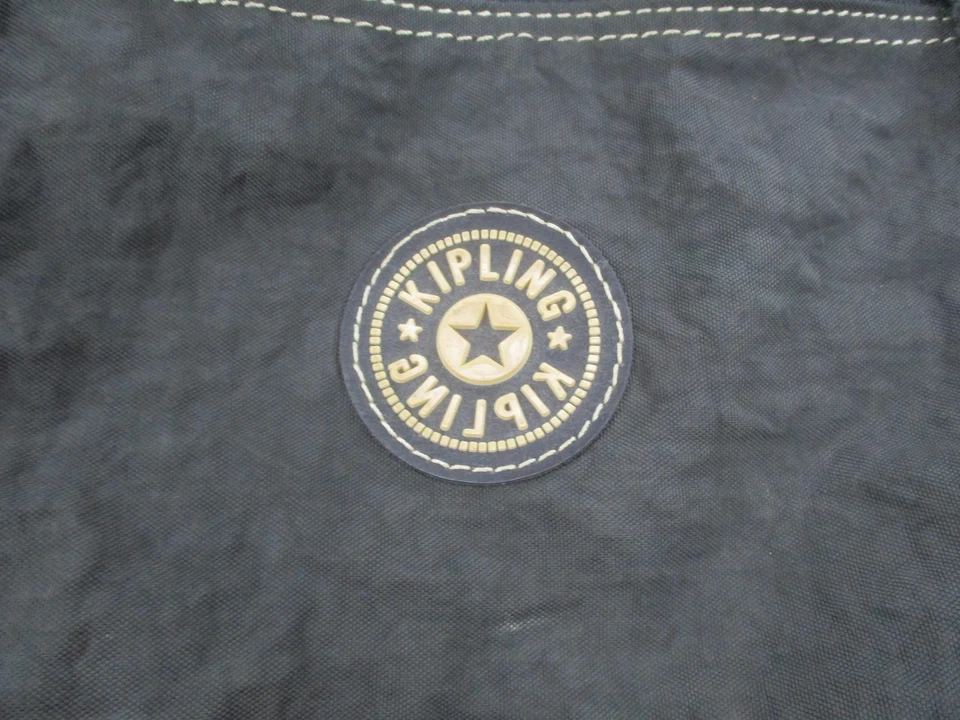 Bolso de hombro de lona de viaje Kipling negro de nailon fin de semana bolsillos con cremallera Foto 2 de 4