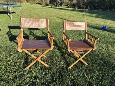 A pair of vintage Telescope leather and bamboo director chairs