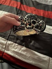 Black skull belt with skulls around and cowboy style pearls