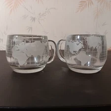 Pair Of Vintage Nestle Etched Clear Glass World Continents Coffee Mugs