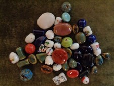 Ceramic beads, 4.2 ounce bags, varied sizes, designs and colors