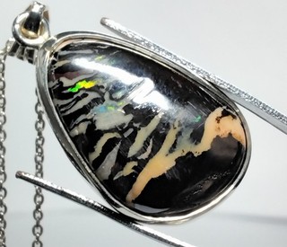 Boulder opal pendant and chain 925 ss . colour aqua purple green red colour