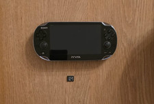 Sony PlayStation Vita (Black) with Thurstmaster Case, 16gb Memory Card and box