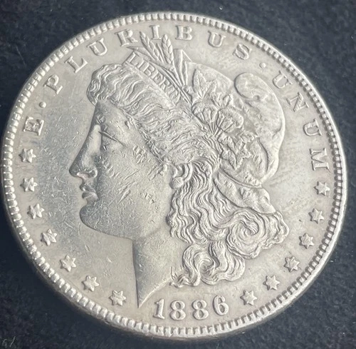 1886 MORGAN SILVER DOLLAR, ESTATE SALE, VF,  FEELS CLEANED, 90% SILVER #0124