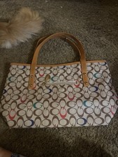 Tote With G s On It
