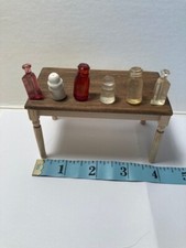 Miniature Dollhouse Plastic Bottles. 1:12. 6 bottles, 2 of each. Colors vary.