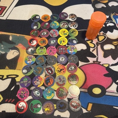 Random Package of 50 Assorted Collector Pogs With Holder. **Read Description**