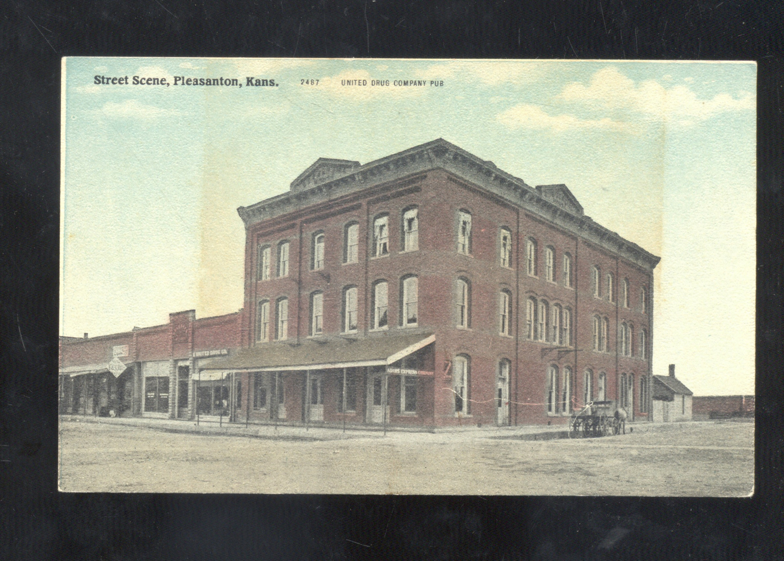 PLEASANTON KANSAS DOWNTOWN STREET SCENE VINTAGE POSTCARDUNITED DRUG CO