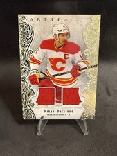2025-26 UD Artifacts Hockey Mikael Backlund Gold Material Dual Jersey /199