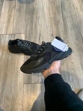 Image of Black kids Lacoste trainers uk size 2