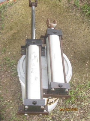 Used 3 1/4'' x 12'' air cylinders. Aluminum body, steel ends. Feet, Clevis.
