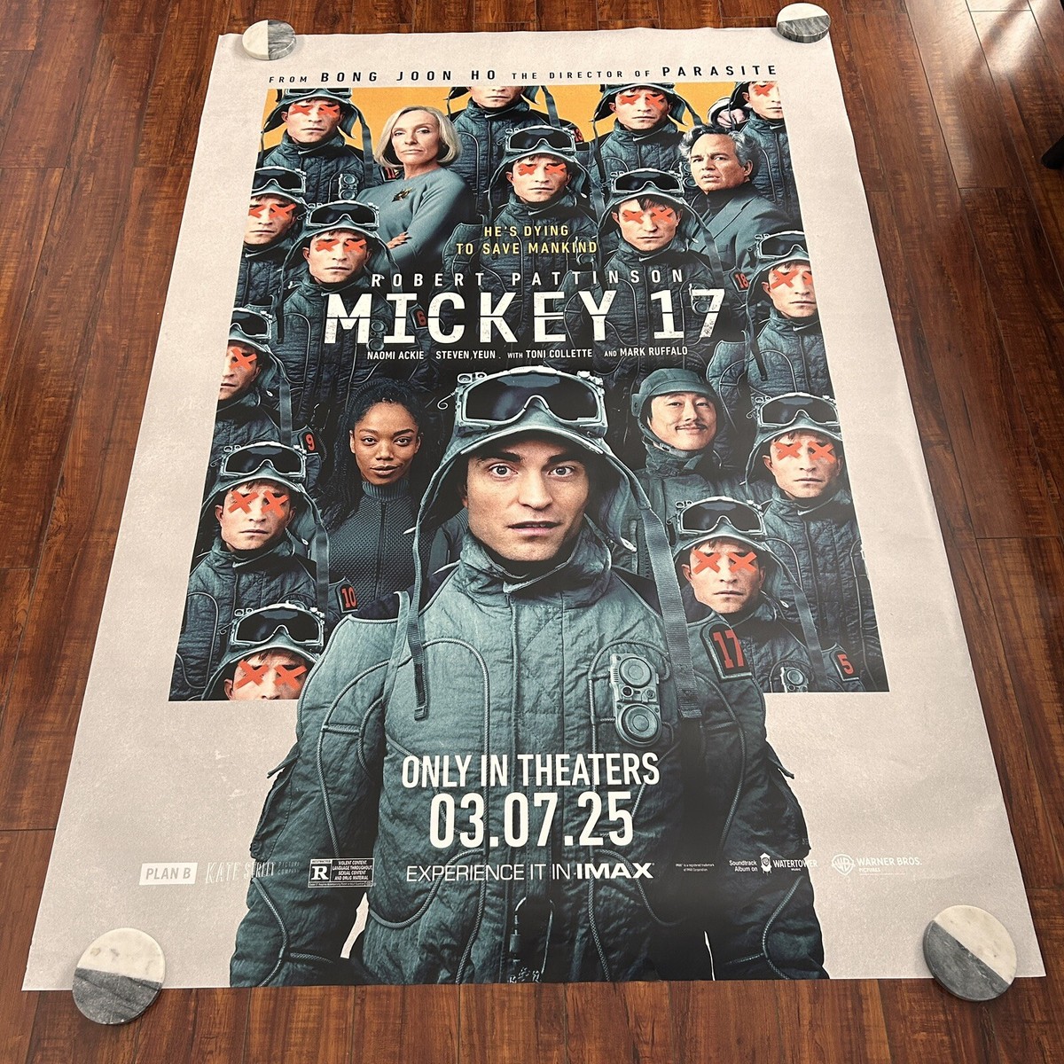 MICKEY 17 Robert Pattinson Group Warner Bros Bus Stop Movie