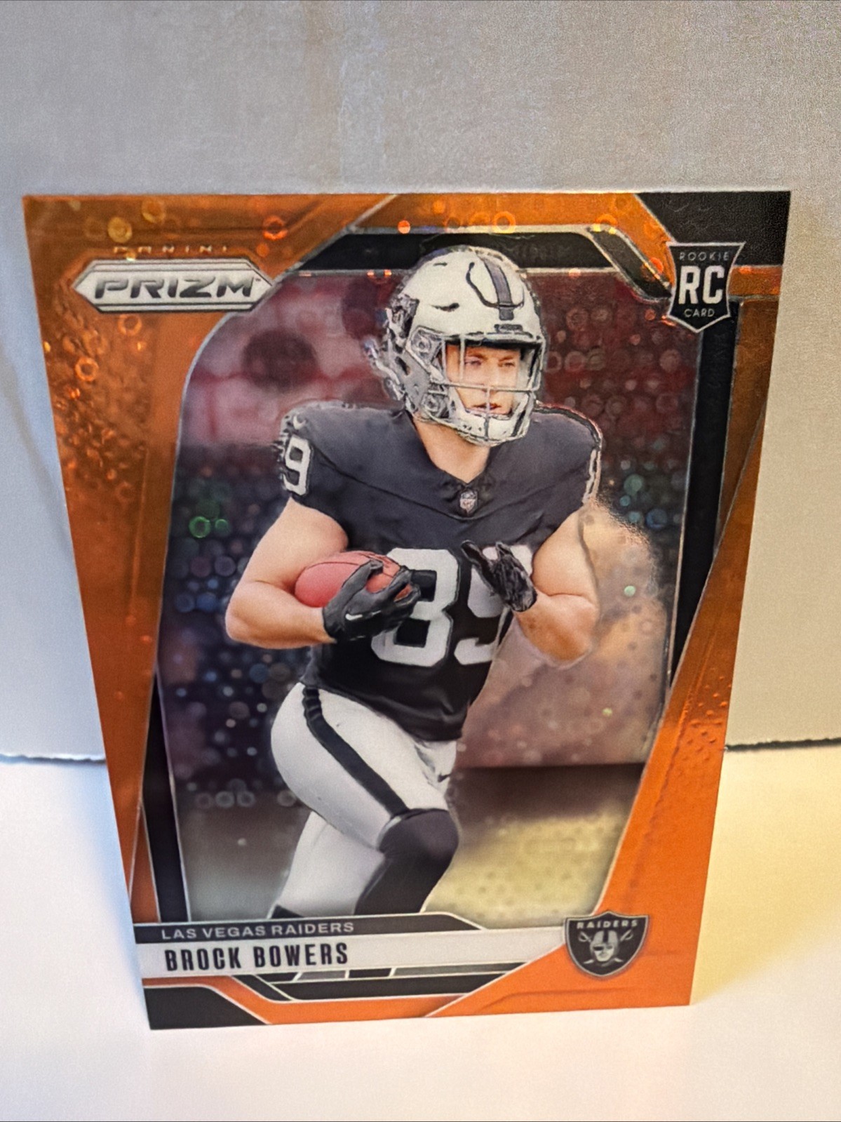 2024 Panini Prizm Orange Disco Prizm Rookie Brock Bowers #315 Las Vegas Raiders