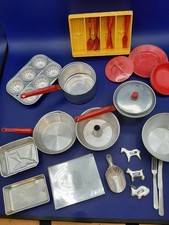 Lot of children's play bakeware and misc. plastic dishes. 1950's. Red handles.