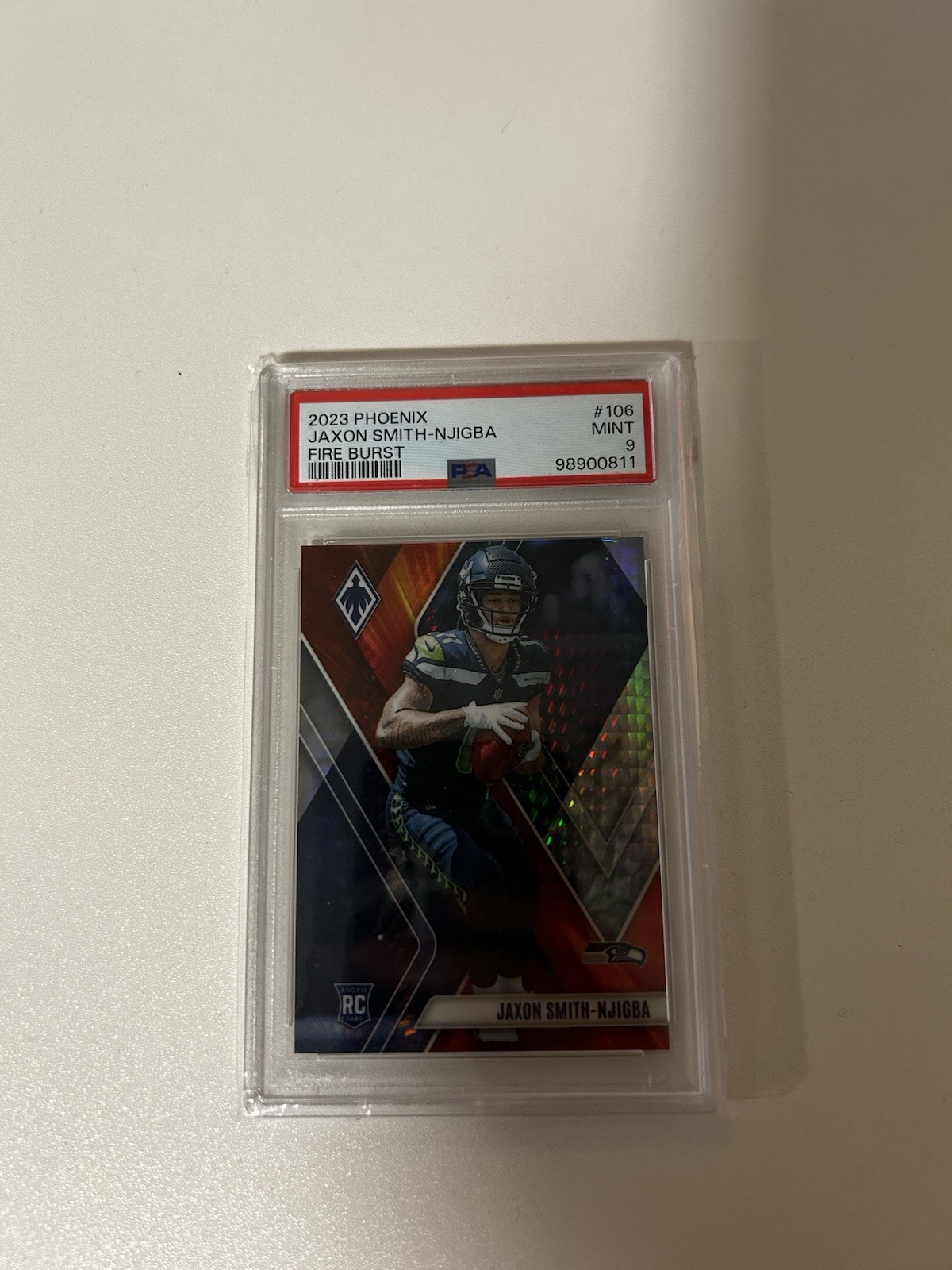 2023 Panini Phoenix - Rookies Jaxon Smith-Njigba #106 Fire Burst /340 (RC)