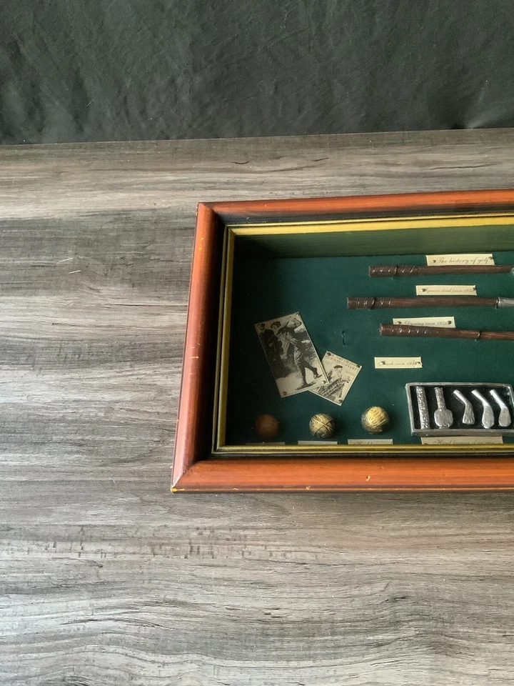 Expositor de caja de sombra de hierros y pelotas de golf historia vintage de la evolución del golf Foto 2 de 4