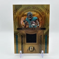 2024 Panini Gold Standard - Gold Rush Travis Etienne #GR-TEJ /299 (MEM)