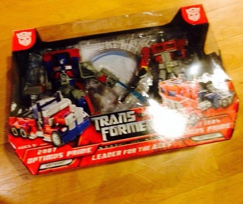 Transformers 2007 And 1984 Optimus Prime Leader For The Ages 2 Pack Giftset