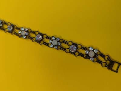 Konplott Armband . Weiße Steine, einige sind rausgefallen . Messing .
