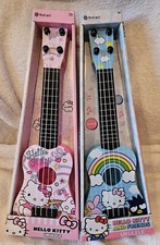 HELLO KITTY PAIR OF PINK  BLUE UKULELES. NIB. BEING DISCONTINUED SOON. GRAB NOW