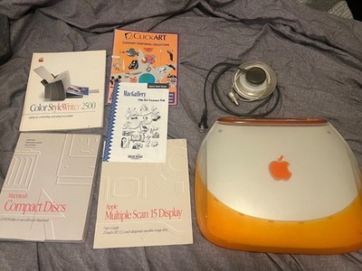 Apple iBook Clamshell tangerine working with extras, dvds, and others