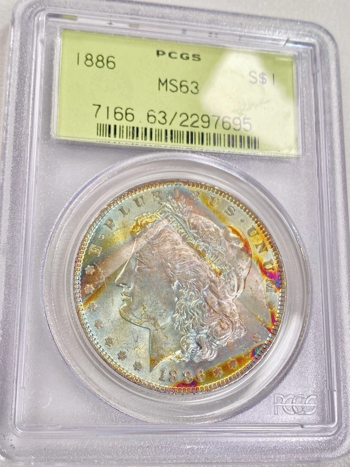 Dólar de plata Morgan 1886 graduación profesional MS63 OGH soporte verde antiguo rollo extremo arco iris tonificado Foto 4 de 4