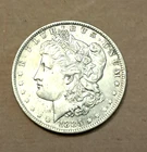 1885-O Morgan silver dollar AU+ condition