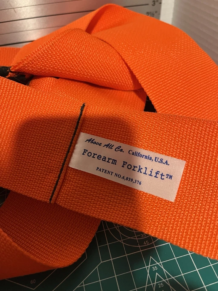 Correa de elevación y movimiento para carretilla elevadora de antebrazo naranja  Foto 3 de 4