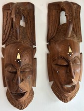 Authentic pair of handmade wooden male and female African hand carved face masks