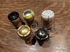 5x Champagne Corks & Cages,by various makers ~ Sold in aid of CANCER RESEARCH UK