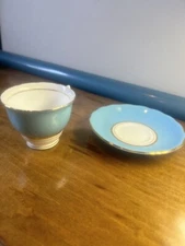 blue with gold trim bone china cololough tea cup and saucer