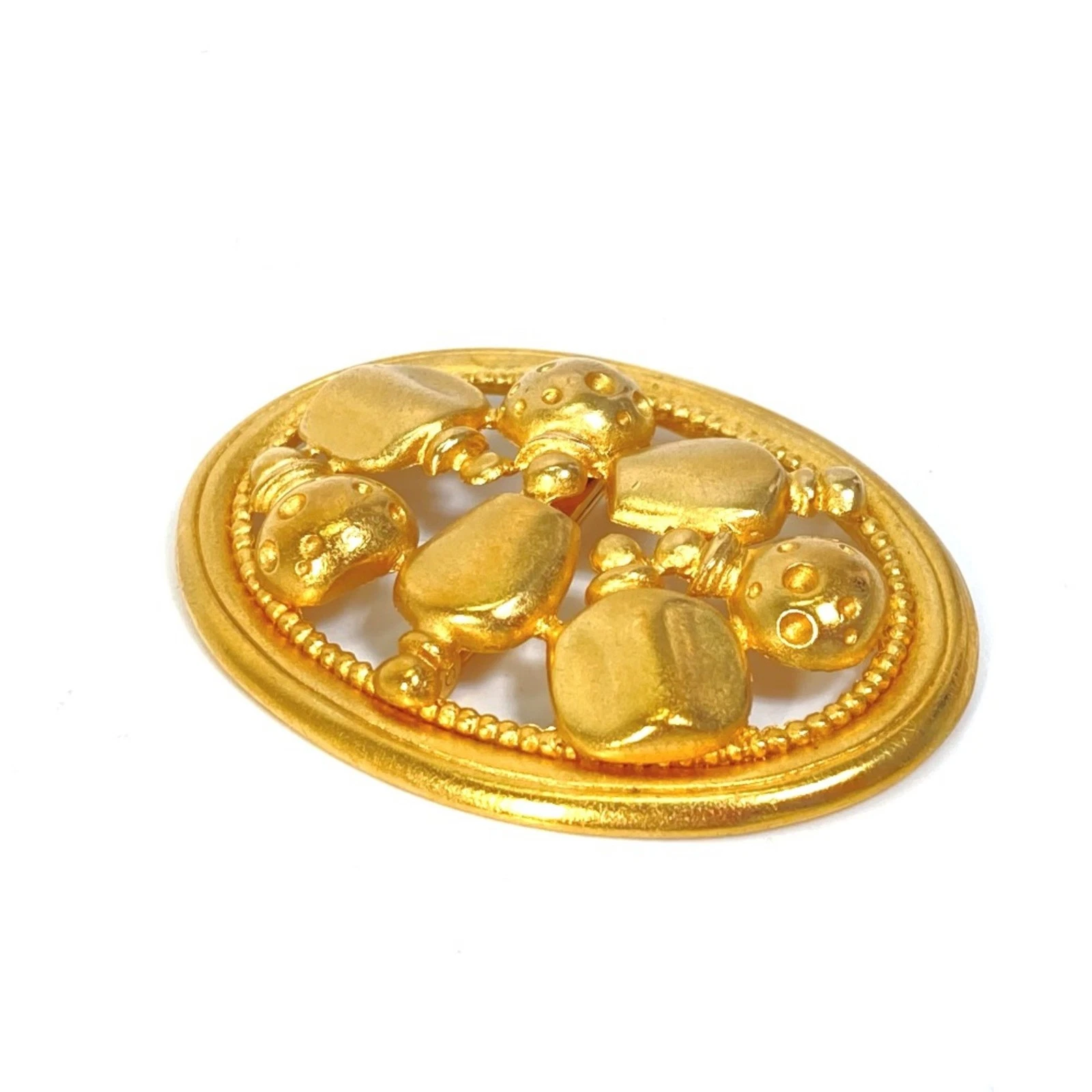 Bijou broche Dior plaqué or authentique