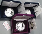 3 PROOF Silver American Eagles. 1986-s, 2004-w, 2005-w. 1 oz .999 each. Box/COA