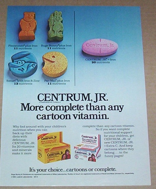 1985 print ad page Centrum Jr vitamins vs PacMan Flintstones Smurf