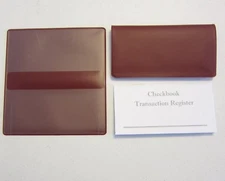  1 BURGUNDY VINYL CHECK BOOK COVER & 1 NEW CHECKBOOK TRANSACTION REGISTER