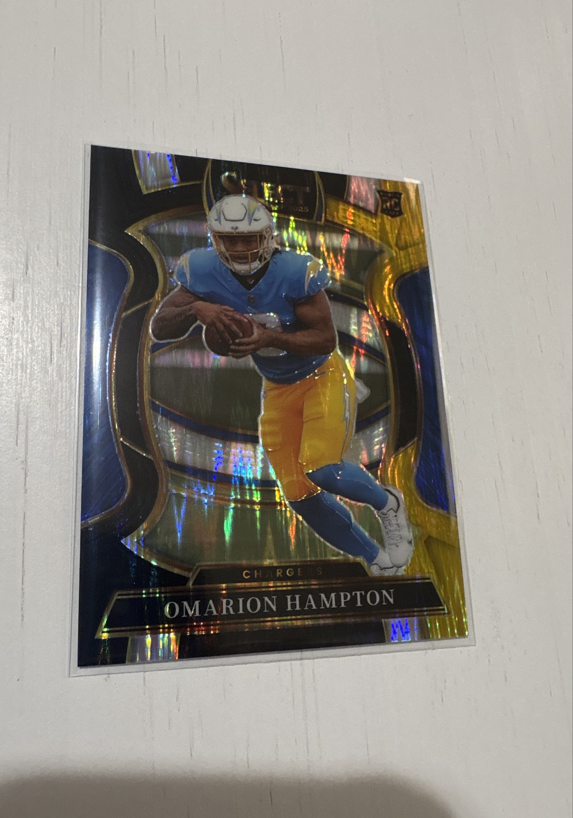 2025 Panini Select - Concourse Omarion Hampton #2 Black & Gold Shock Prizm (RC)