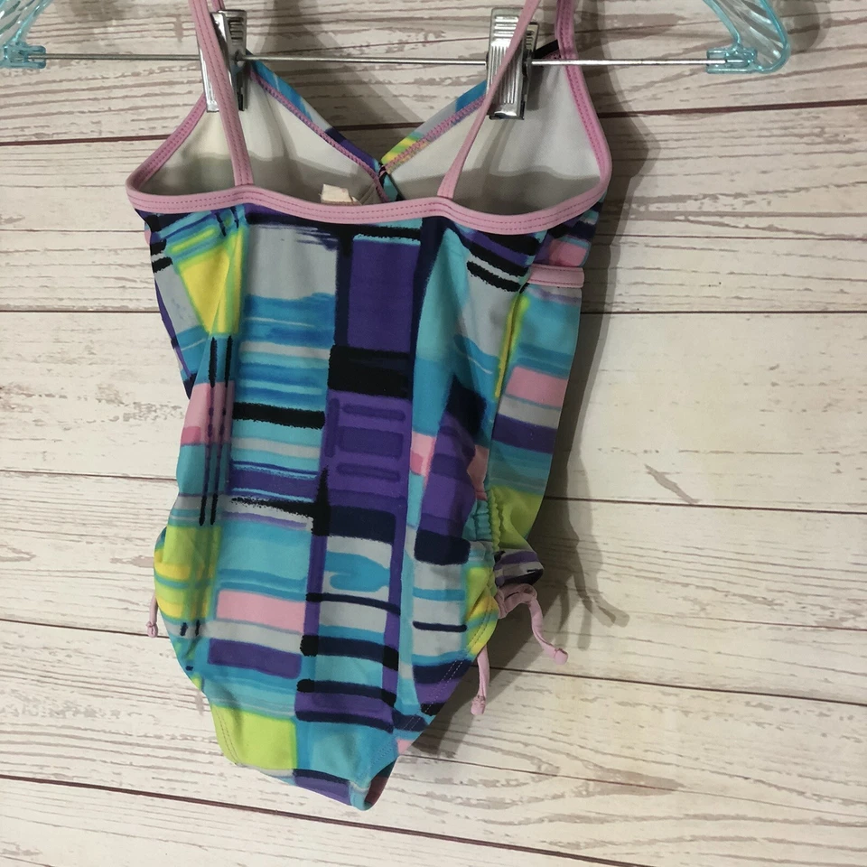 Traje de baño Xhilaration para niñas XS 4-5 Geo traje de baño de una pieza rosa azul púrpura Foto 2 de 4