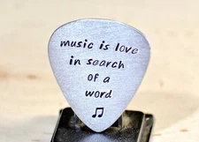 Aluminum Guitar Pick Handmade with the saying Music is Love
