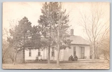 RPPC Rural Home in Winter Pines~Grandma & Teen on Stoop~Men @ Other Corner~c1910
