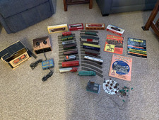 Collection of HO trains,cars, engines,,track ,books, transformer,new, used as is